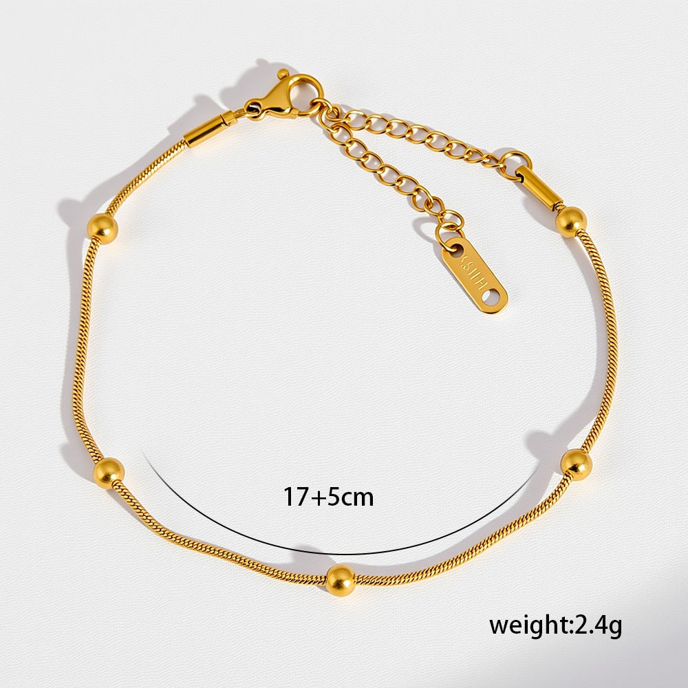 Pulsera esencial en tono dorado
