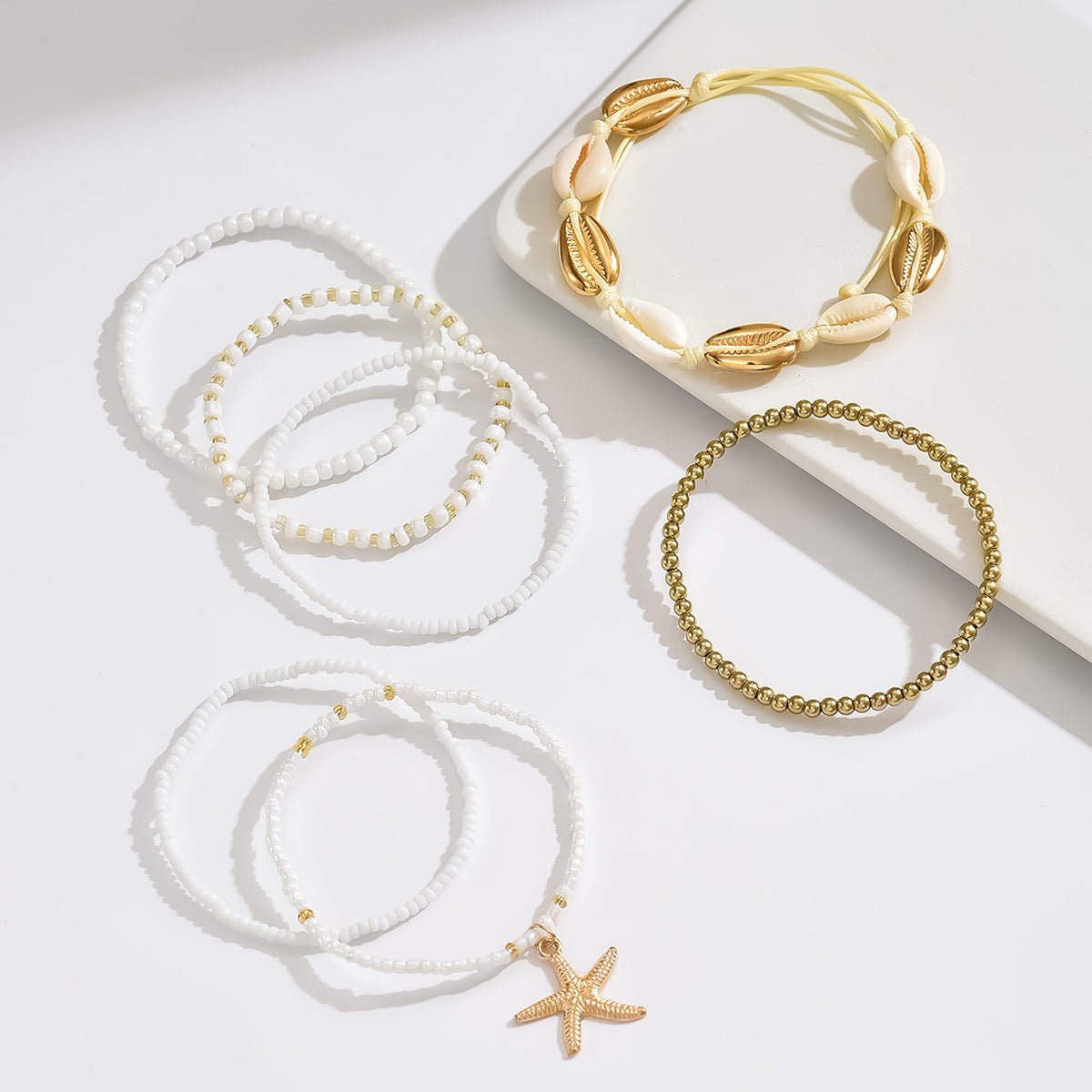 Set de tobilleras con cuentas de conchas y estrellas de mar
