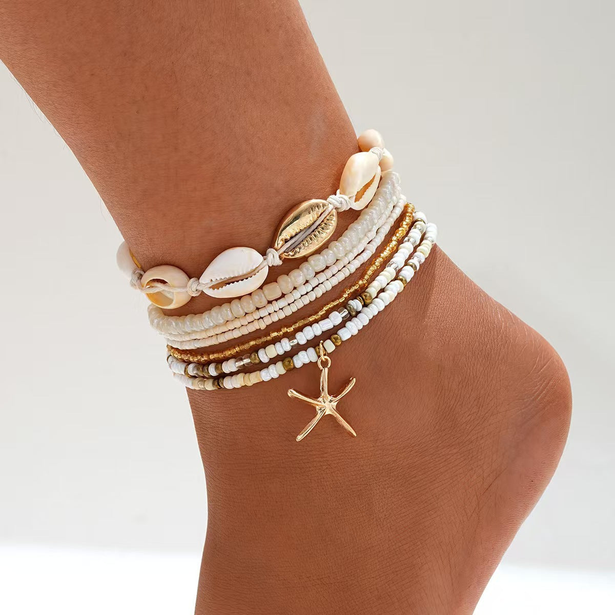 Set de tobilleras con cuentas de conchas y estrellas de mar