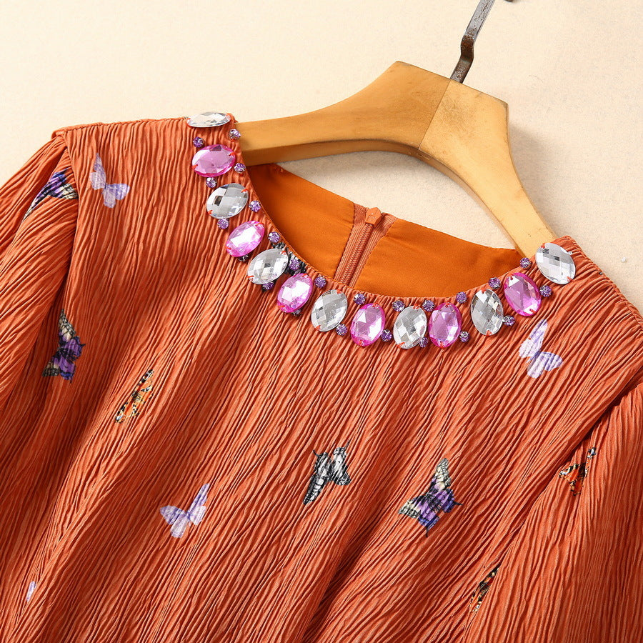 Elegante vestido de manga larga con cintura adornada